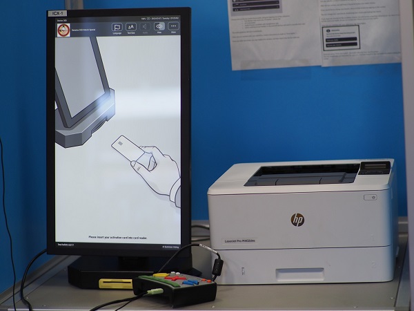 Picture of Dominion’s ImageCast X (ICX) Ballot Marking Device touch screen and printer at a voting booth.