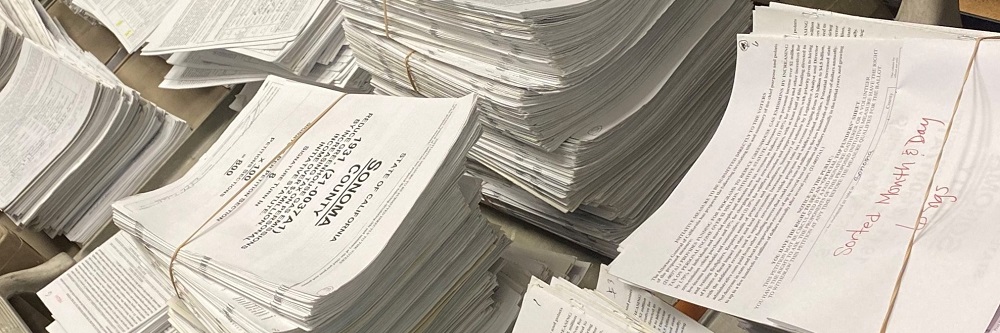 A picture of a multiple stacks of petitions.