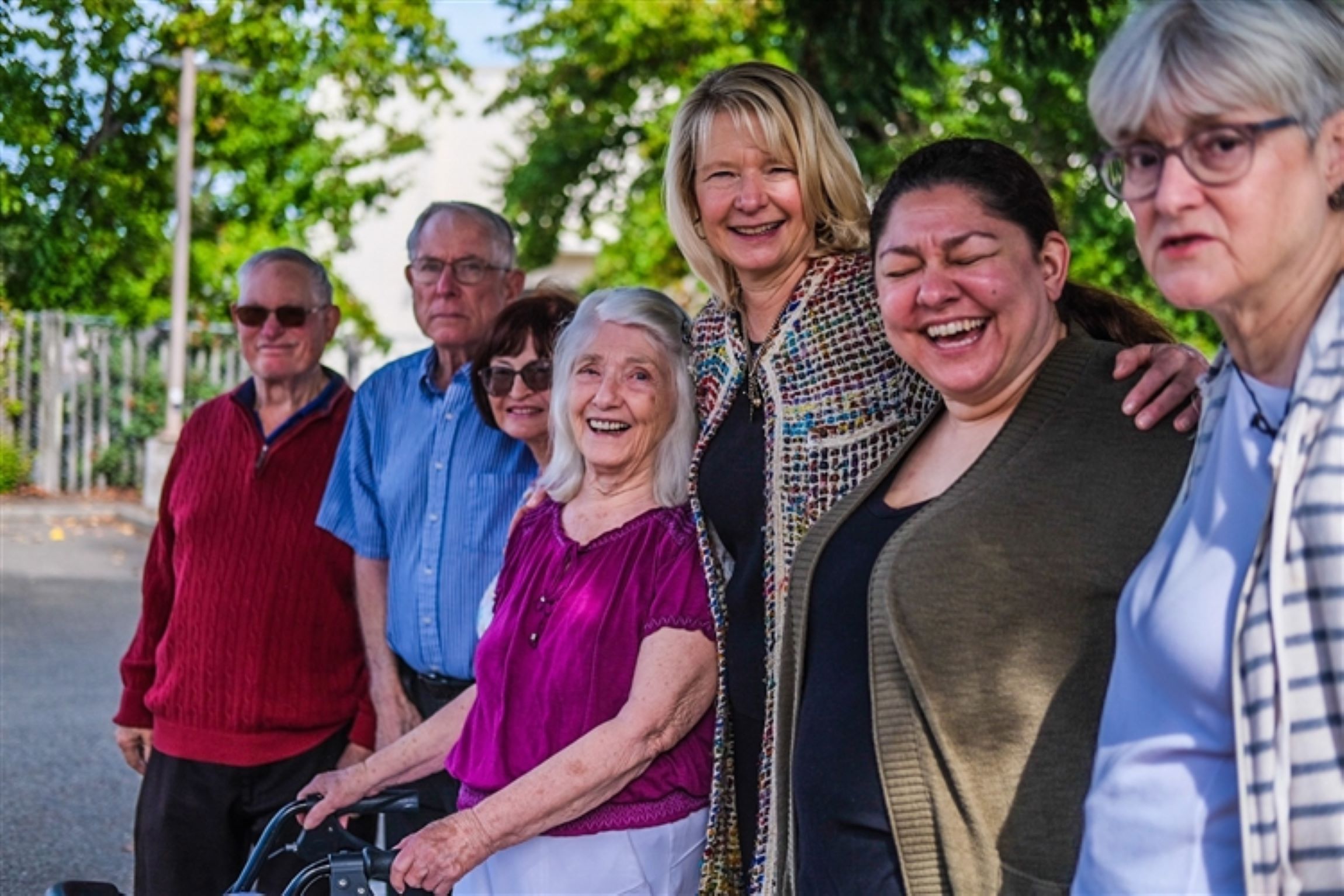 group of adults standing outside