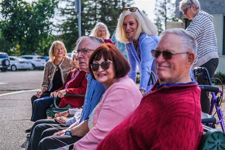 Group of older adults sitting outside